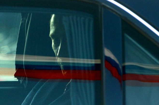 Russian President Vladimir Putin leaves Berlin's Tegel airport in his limousine February 9, 2003. Putin is on a two-day visit to Germany for talks with German Chancellor Gerhard Schroeder, with whom he shares deep misgivings about a possible U.S. attack on Iraq, with talks expected to focus on a new Franco-German initiative to avert war. REUTERS/Alexandra Winkler AX/JOH/CRB - RTRHZYX